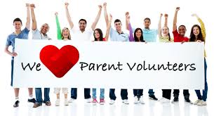 Adults holding a sign that reads We love Parent Volunteers